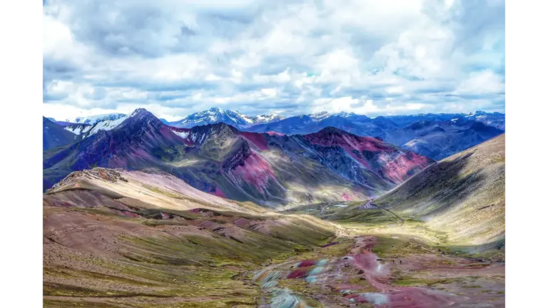 Stunning view of Rainbow Mountain in the Andes, showcasing vibrant colors and sweeping landscapes shaped by the kind of unusual nature that doesn’t even look real.