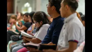 In daily devotional, a group of people are studying the Bible.