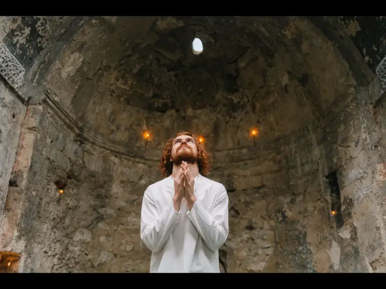 In today's daily devotional, a man is praying withing a palace.