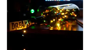 A vibrant, conceptual photo showcasing a dream theme with illuminated fairy lights in a bottle, subtly echoing the mystery of recurring dreams.