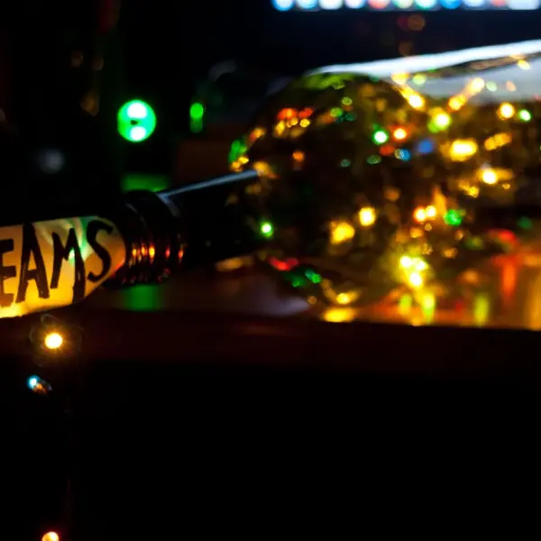A vibrant, conceptual photo showcasing a dream theme with illuminated fairy lights in a bottle, subtly echoing the mystery of recurring dreams.