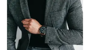smart luxury style comes through in this close‑up of a man in a gray suit showcasing and capturing an elegant and professional fashion moment