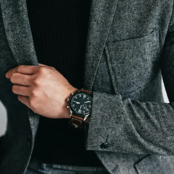 smart luxury style comes through in this close‑up of a man in a gray suit showcasing and capturing an elegant and professional fashion moment