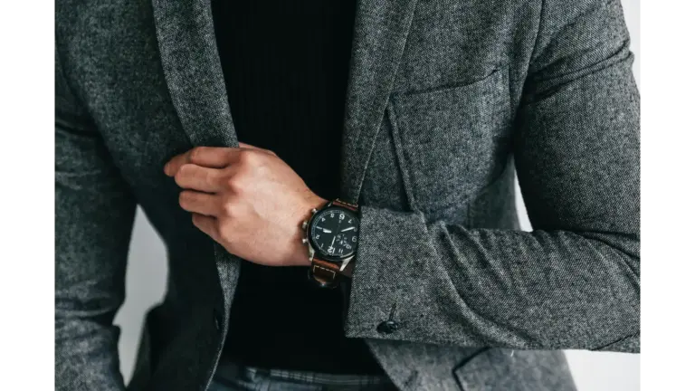 smart luxury style comes through in this close‑up of a man in a gray suit showcasing and capturing an elegant and professional fashion moment