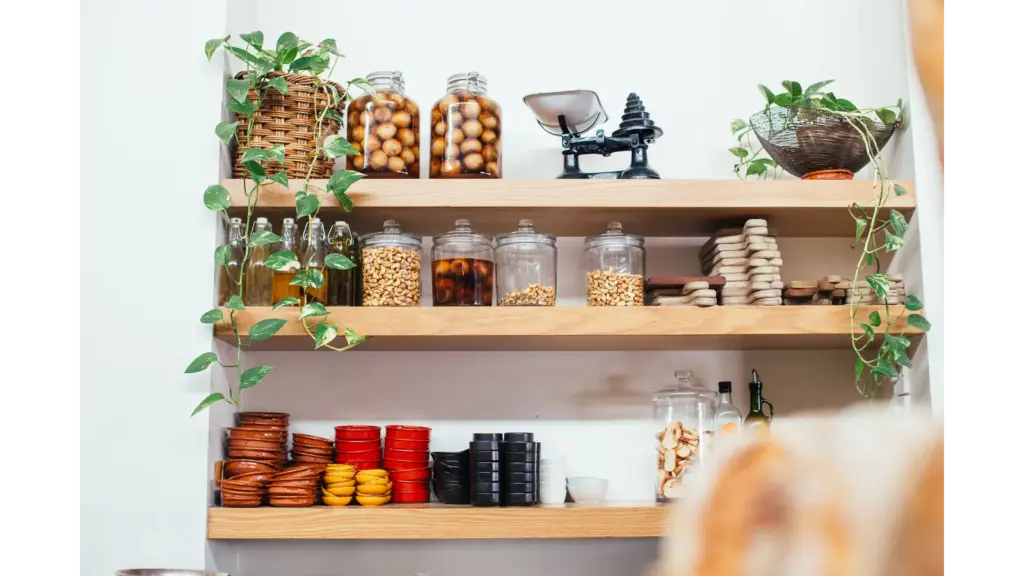 Stylish pantry shelves with glass jars, bowls, and greenery create a decorative, organized look that elevates any kitchen upgrade.