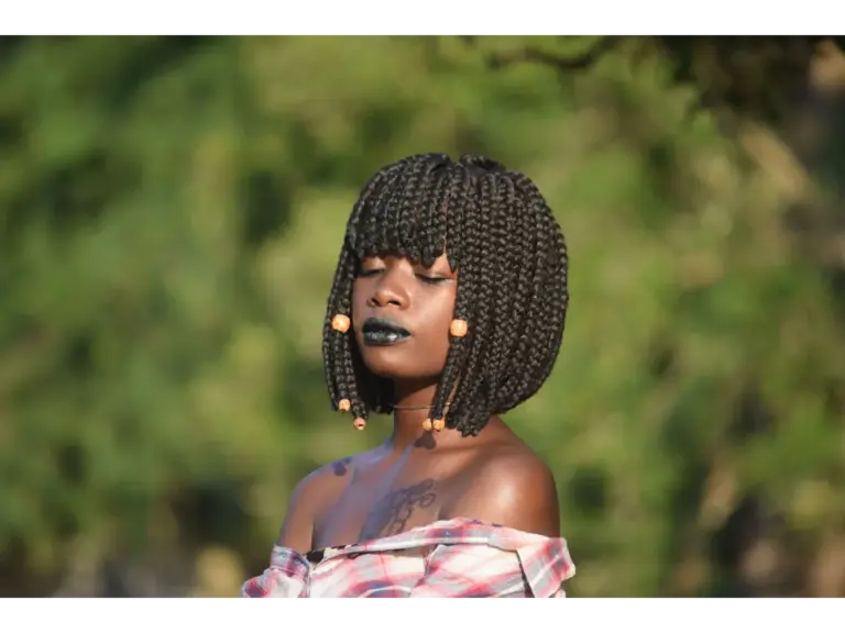 Beautiful portrait of a woman with bob braids and black lipstick in Mombasa, Kenya