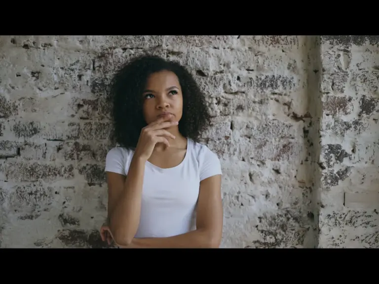 In daily devotional, a  young woman is deep in thought showing that we have ownership our  thoughts. 