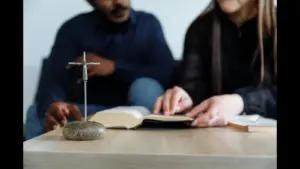 In daily devotional, a man and woman are studying the scriptures together.