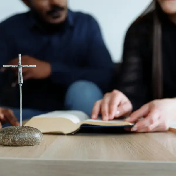 In daily devotional, a man and woman are studying the scriptures together.