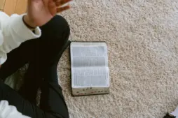 A person is reading and discussin Scripture.