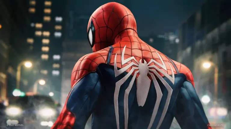 Spider-Man revealed facing away from camera, showing spider Logo on his back.
