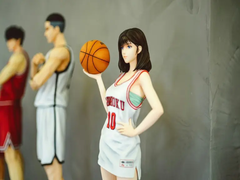 Woman from an Anime figurine holding a basketball.