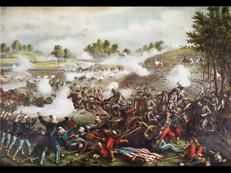 Civil War battle scene depicting soldiers fighting with rifles and cannons, smoke filling the air, fallen men, and flags on both Union and Confederate sides.