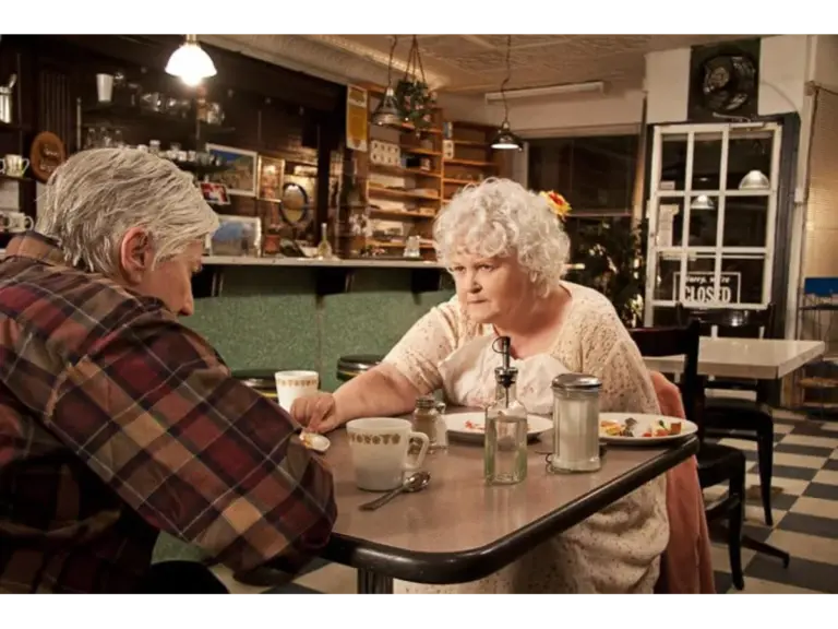 Olympia Dukakis as Stella and Brenda Fricker as Dot in "Cloudburst" sitting at a table in a diner, engaged in a serious conversation.