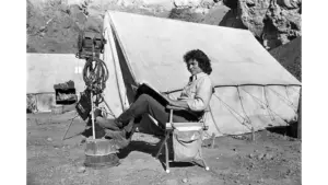 Michael Landon takes a break during filming of Little House on the Prairie to read the script.
