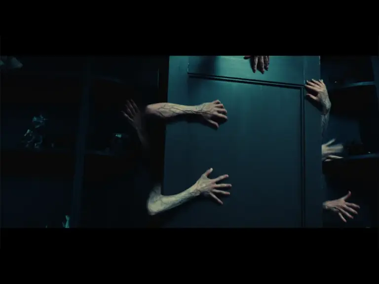 Hands reach through a door in “Other Mommy,” one of October’s horror movies