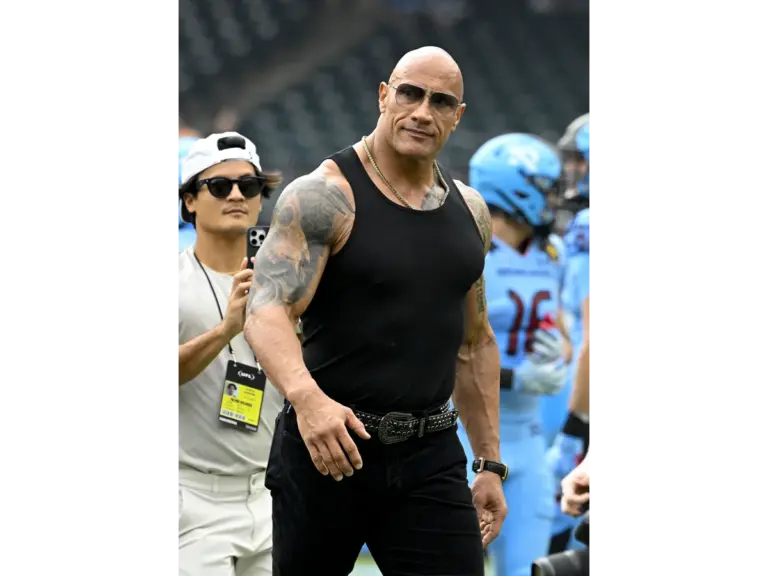 Mar 30, 2024; Arlington, TX, USA; UFL owner Dwayne Johnson aka The Rock walks off the field before the game between the Arlington Renegades and the Birmingham Stallions at Choctaw Stadium.