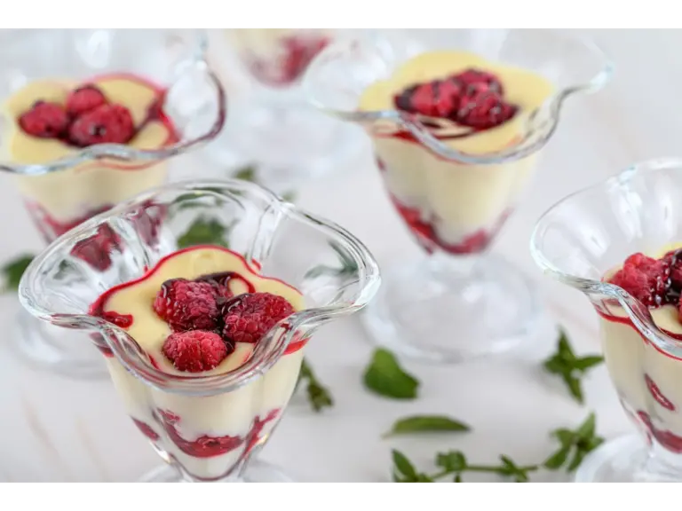 Berry cheesecake desserts arranged on a white table, perfect for quick meals.