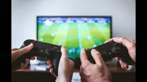 two people playing a football video game.