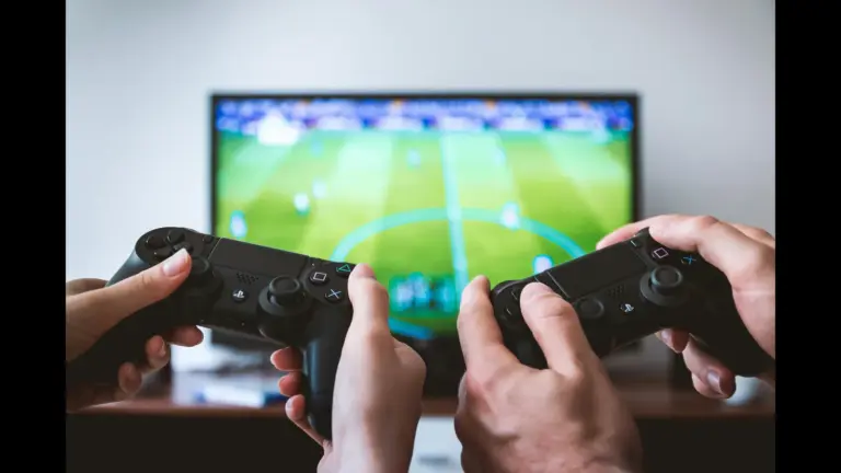 two people playing a football video game.