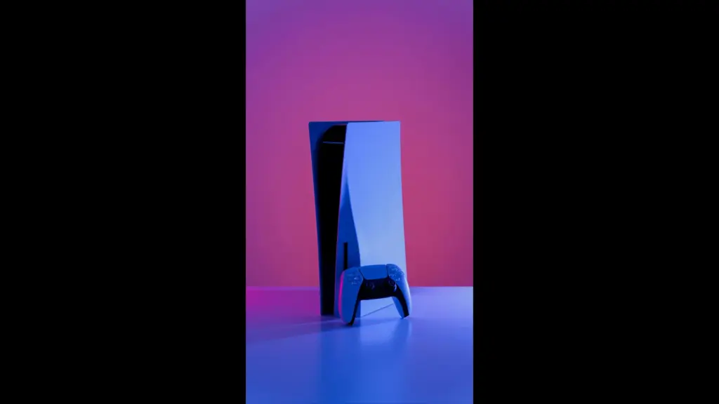 A PlayStation 5 console and controller under purple lighting, the system for the PS Plus October 2026 free games.
