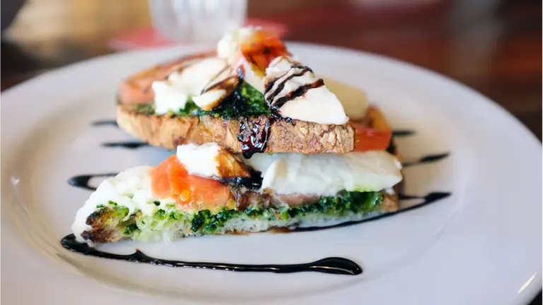 Delicious Caprese bruschetta with fresh mozzarella, tomatoes, and balsamic glaze drizzled on toast is one of those quick meals that feels fancy without the effort.