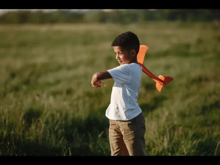 In daily devotional, a young boy is seen playing with a toy. just as Isaac, son of Abraham, would have played at that age.