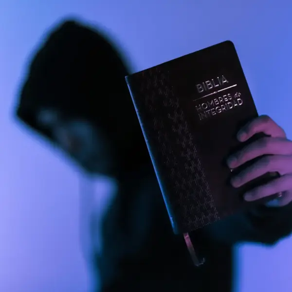 In this daily devotional, someone boldly holds up the Bible for all to see.
