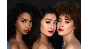 Close‑up portrait of diverse women with striking red lips, emphasizing beauty, confidence, and the subtle makeup tricks that make every feature stand out.