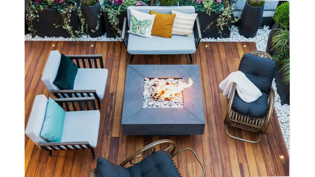 A top‑down view of a modern patio featuring stylish furniture and a central firepit, creating a clean, inviting space perfect for DIY Projects.