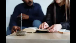 In daily devotional, two people study God's word together.