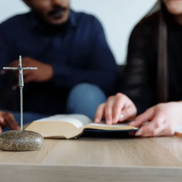 In daily devotional, two people study God's word together.
