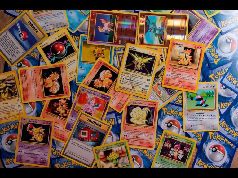 A scattered pile of Pokemon cards, collectible card game