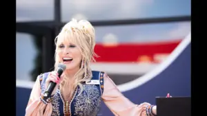 Dolly Parton speaks to the crowd during the grand opening of Dolly's Tennessean Travel Stop in Cornersville on Wednesday June 24, 2026.