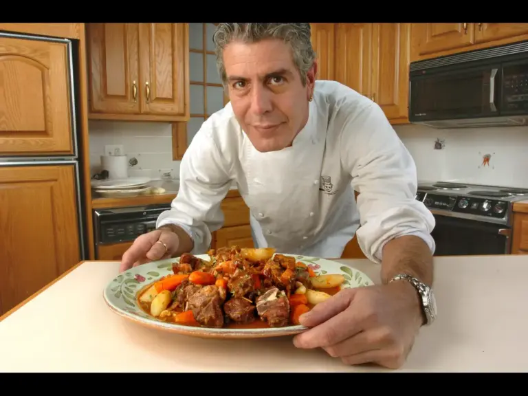 Chef Anthony Bourdain shows an entree he cooked for The Record in the newspaper's Hackensack, New Jersey kitchen, on Oct. 21, 2004.