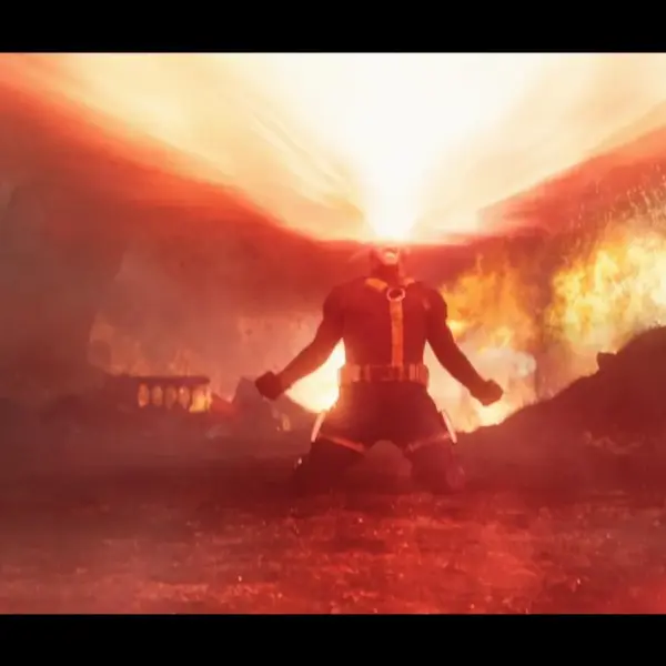 Marvel X-Men's Cyclops, portrayed by James Marsden, unleashes his optic blasts amidst a fiery backdrop, expressing deep grief.