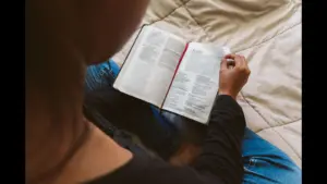 In Thursday's daily devotional, a young woman reads the Bible.