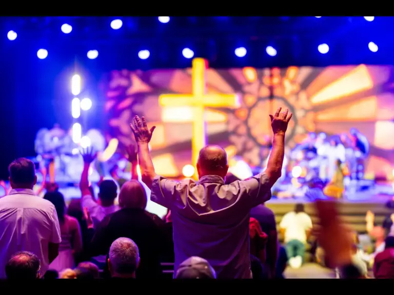 In Thursday's daily devotional, worshippers are seen praising God in a church setting.