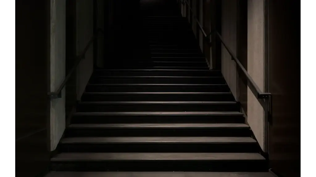 mystical stairs enveloped in darkness, featuring a subtle hint of set hauntings in the shadows.