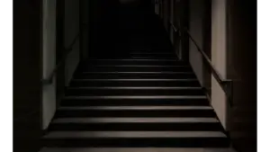 mystical stairs enveloped in darkness, featuring a subtle hint of set hauntings in the shadows.