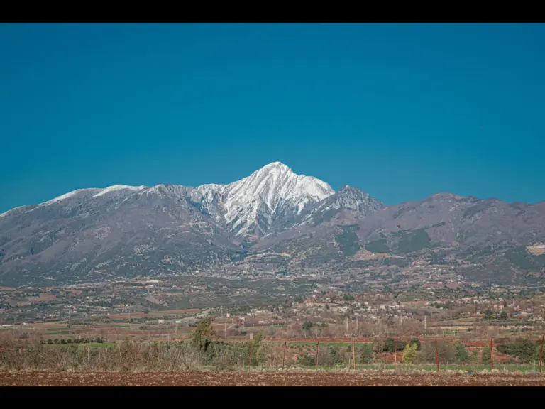 In Tuesday's daily devotional, a snow-capped mountain range is seen in the distance, representing Mt. Hermon in Israel.
