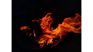 A mesmerizing view of flames dancing in the dark, creating warmth and light, echoing the surreal intensity of fire dreams.