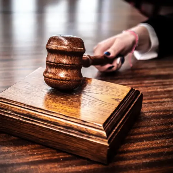 Close-up of a wooden gavel on a judge's desk, symbolizing justice for Jay Lee, gaming companies, court, law suit,