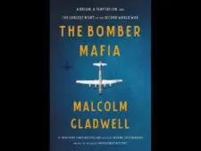 A book cover for "The Bomber Mafia" by Malcolm Gladwell, featuring a blue background with a white airplane illustration and text.