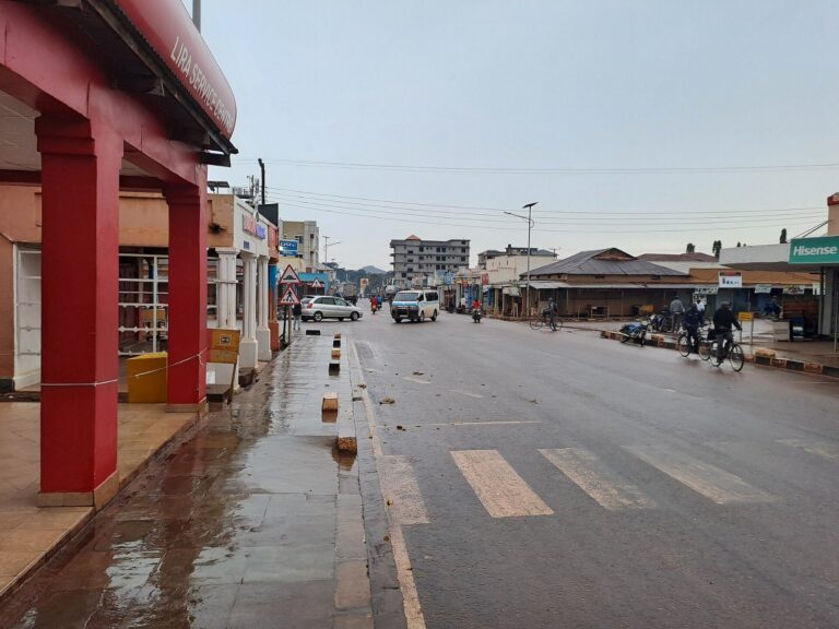 A rain-wet main street on a quiet morning in Lira City, Uganda, where more than 2,000 Lord's Resistance Army survivors gathered for prayer