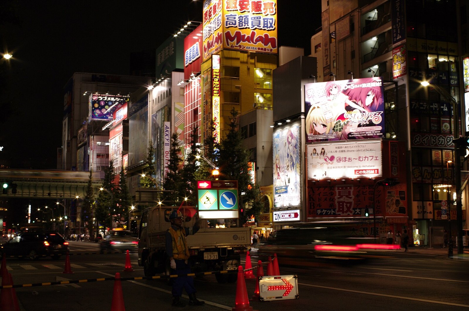 Anime billboards line a street in Tokyo’s Akihabara district, where fans await the Nia Liston anime