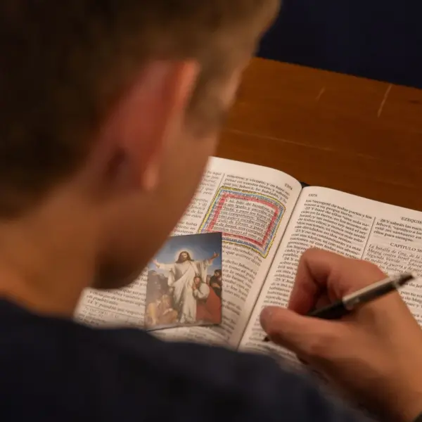 In Wednesday's daily devotional, a man studies the Bible while underlining verses.