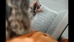In Wednesday's daily devotional, a woman studies the Bible.