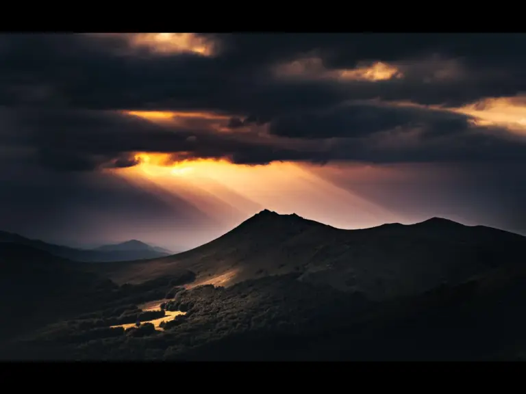 In Friday's daily devotional, a mountain is seen in the distance as a light beams down from heaven. 