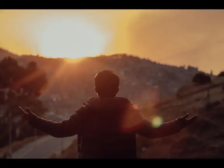 In Thursday's daily devotional, a man faces a mountain with the sun gleaming behind it as he cries out for God's mercy. 